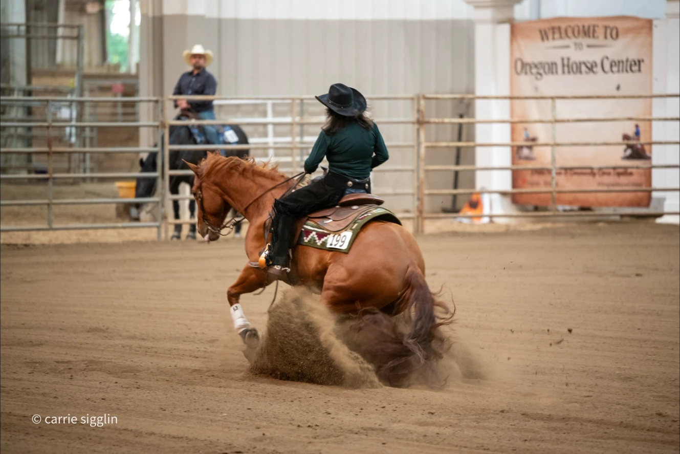 Donna's horse digging in during a sliding stop at the Oregon Horse Center