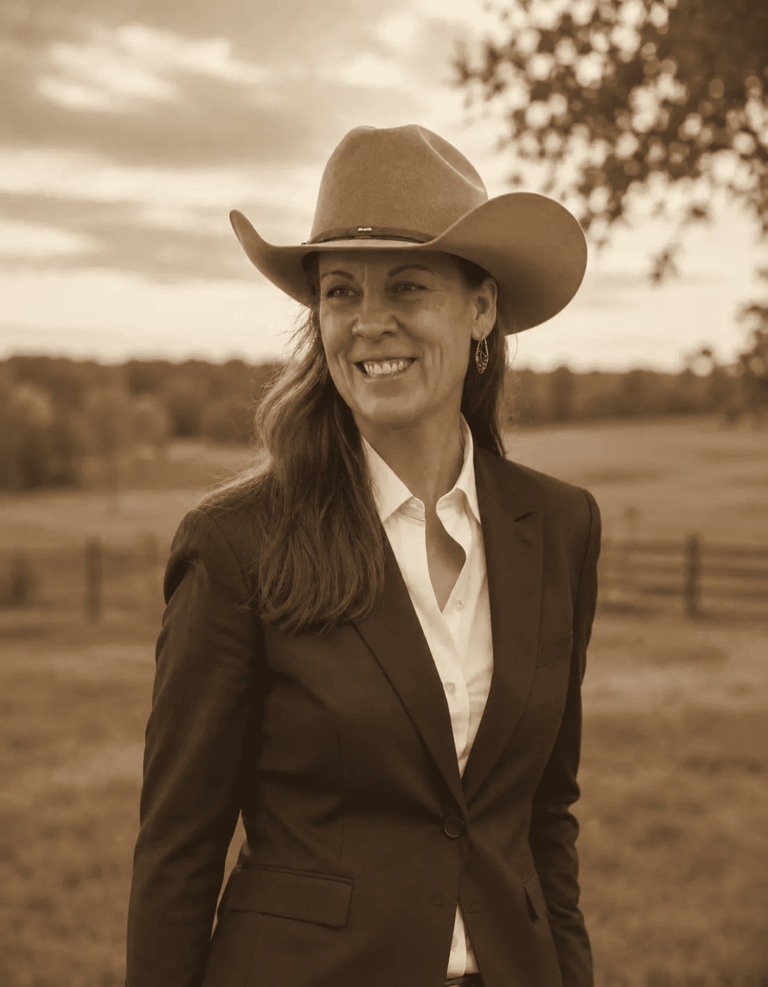 Peggy Bond-Heath, trainer and owner, in a golden-hour field