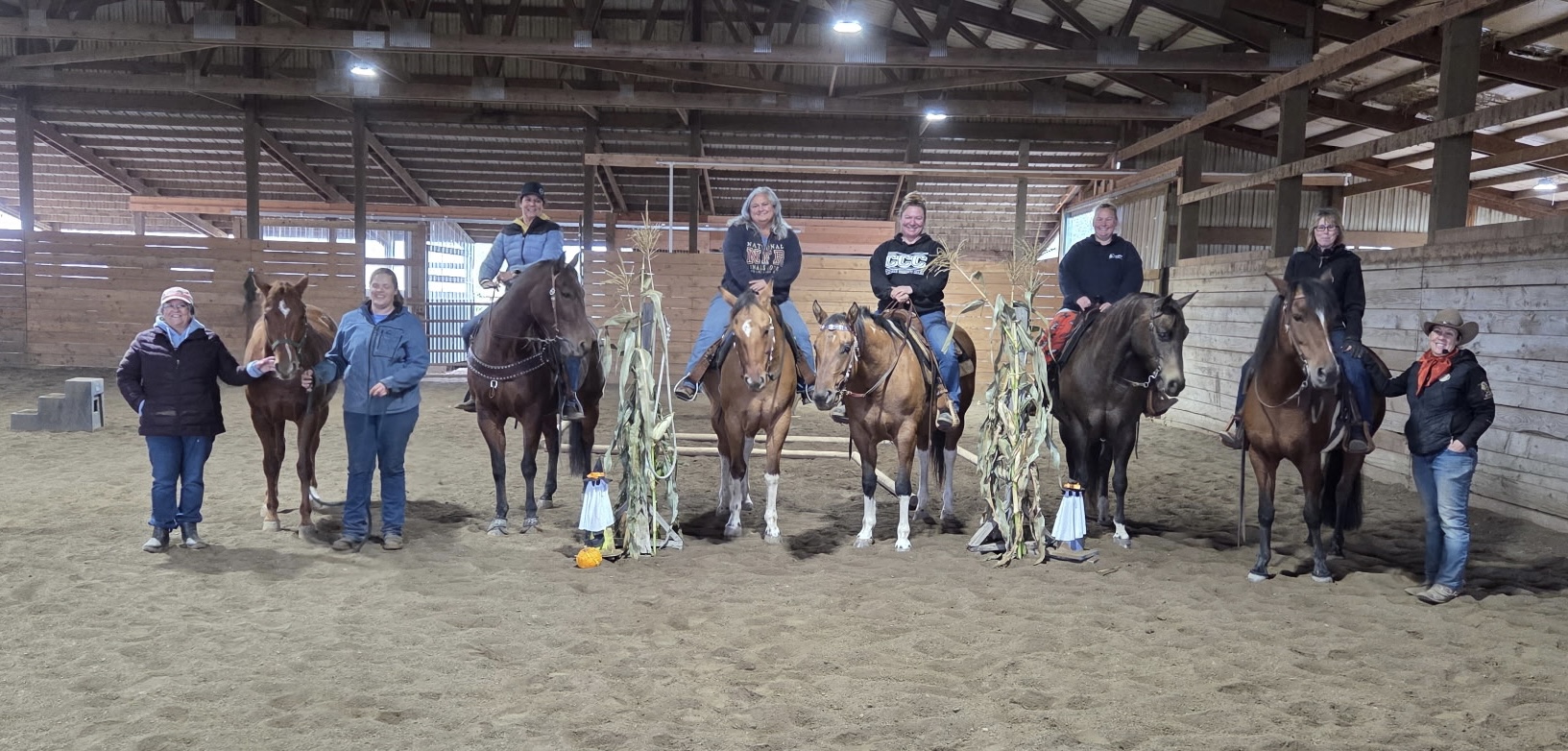 The Northern Grace clinic group lined up with their horses in the indoor arena