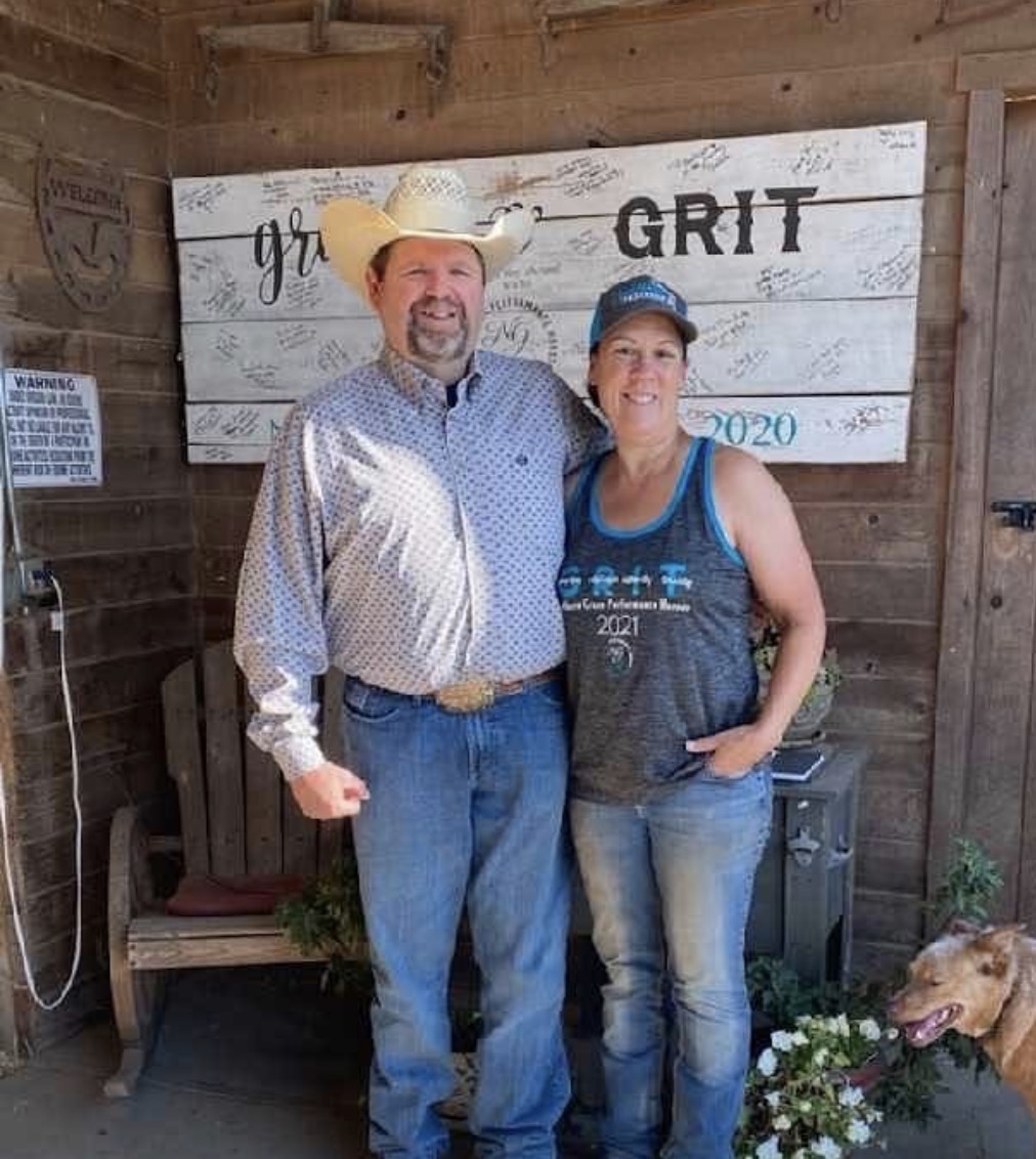 Chuck Nesmith and Peggy Bond-Heath standing together in front of a barn